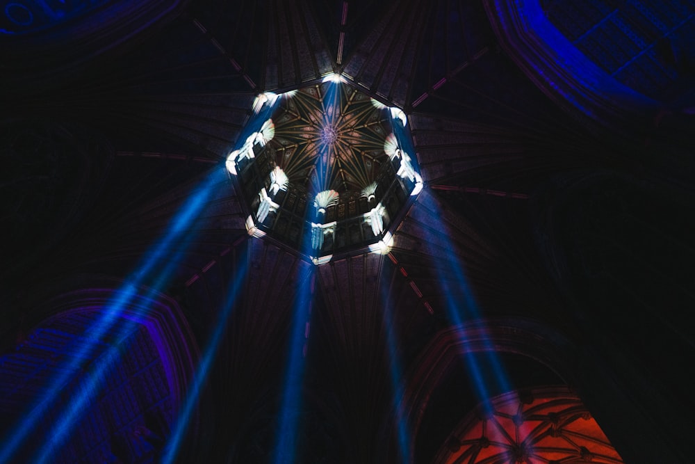 a view of the ceiling of a building with lights on it