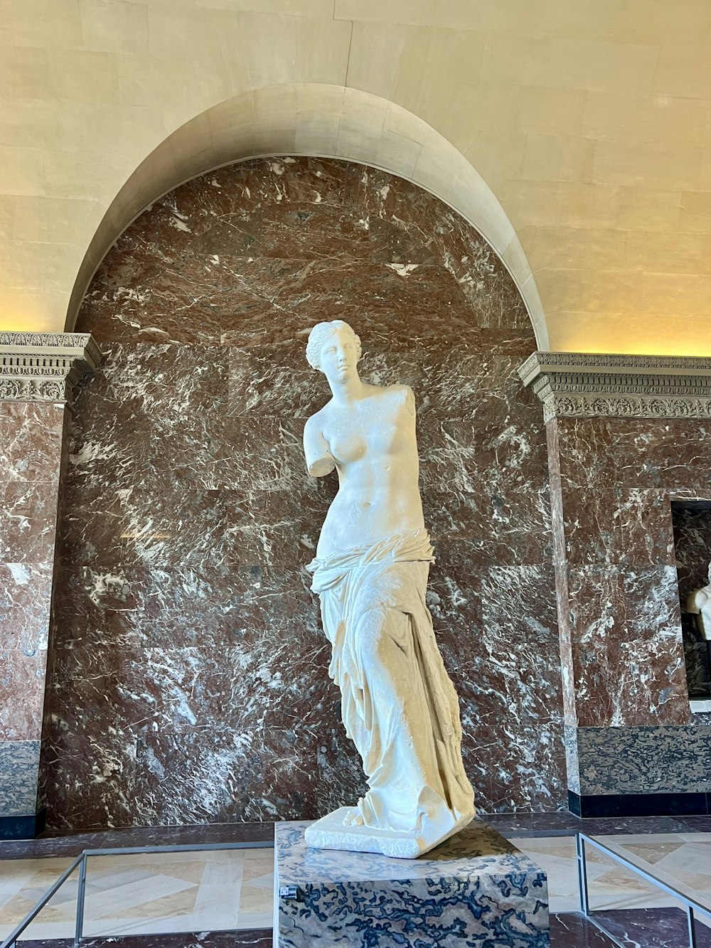a statue of a woman in a marble room