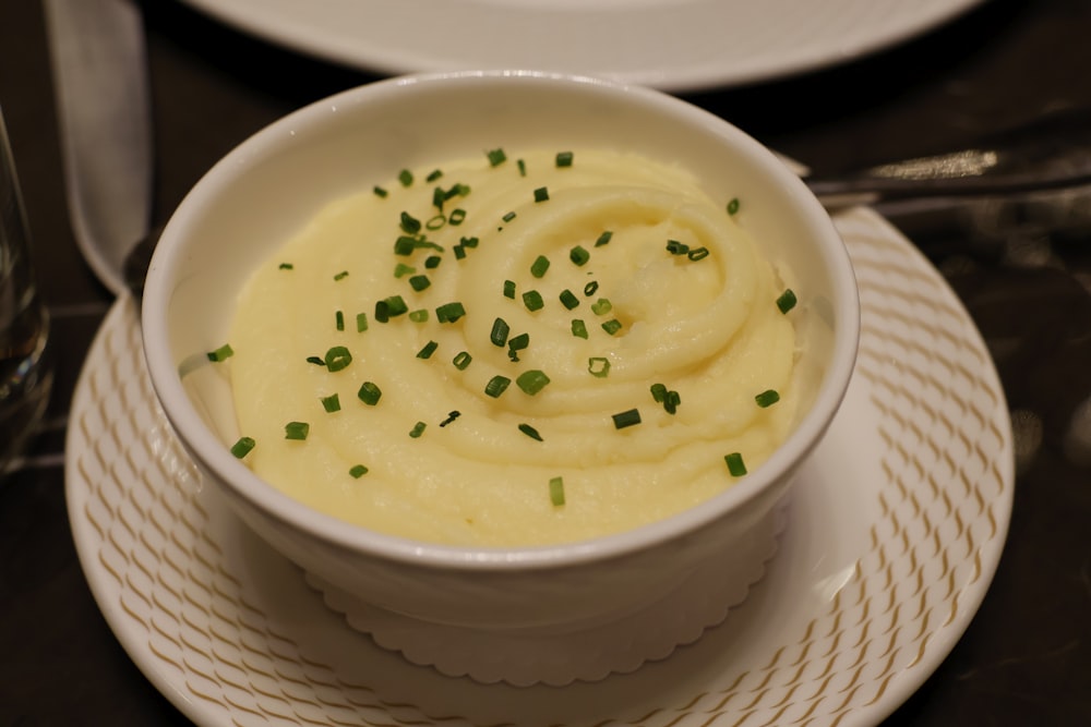 a bowl of mashed potatoes topped with chives