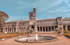 a large building with a fountain in front of it