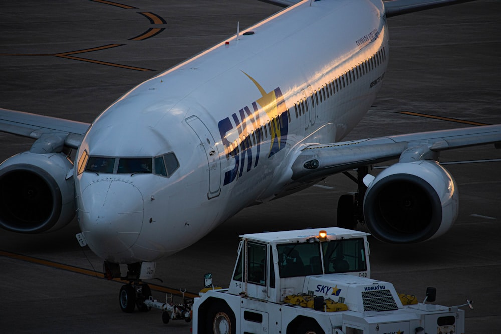 a large jetliner sitting on top of an airport tarmac