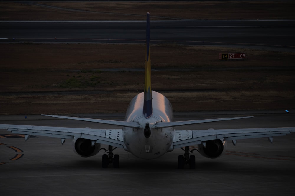 a large jetliner sitting on top of an airport tarmac