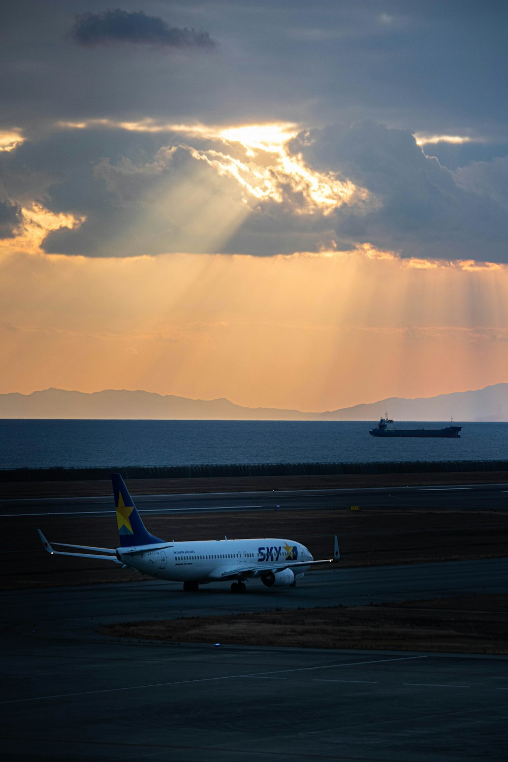 a large jetliner sitting on top of an airport runway