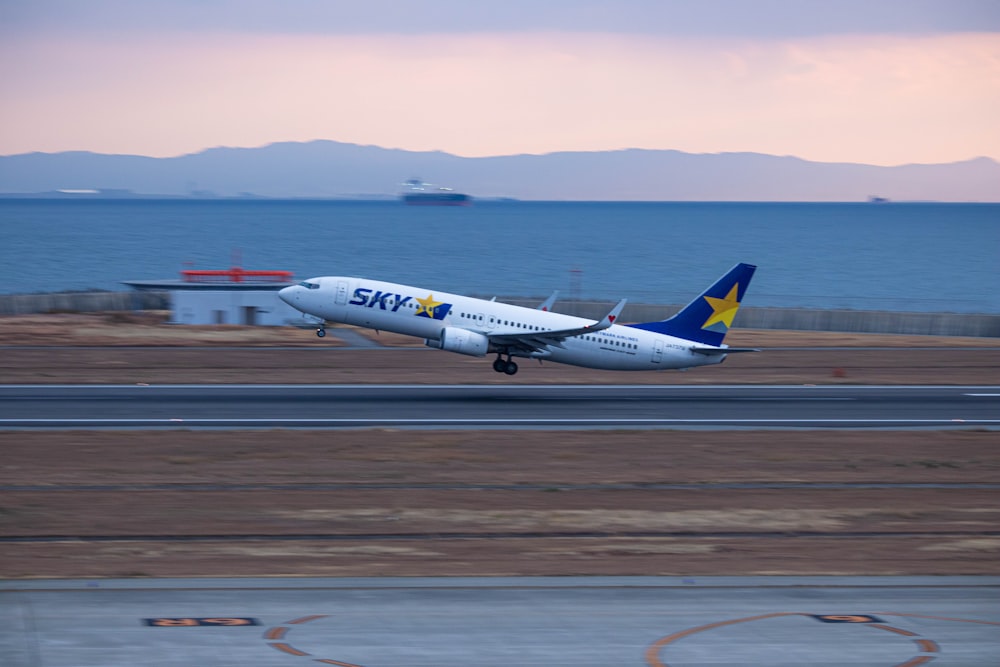 a large jetliner taking off from an airport runway