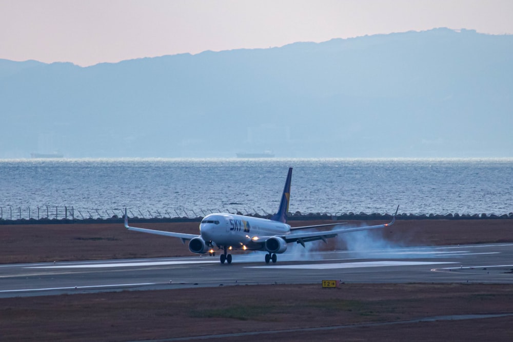 a large jetliner taking off from an airport runway