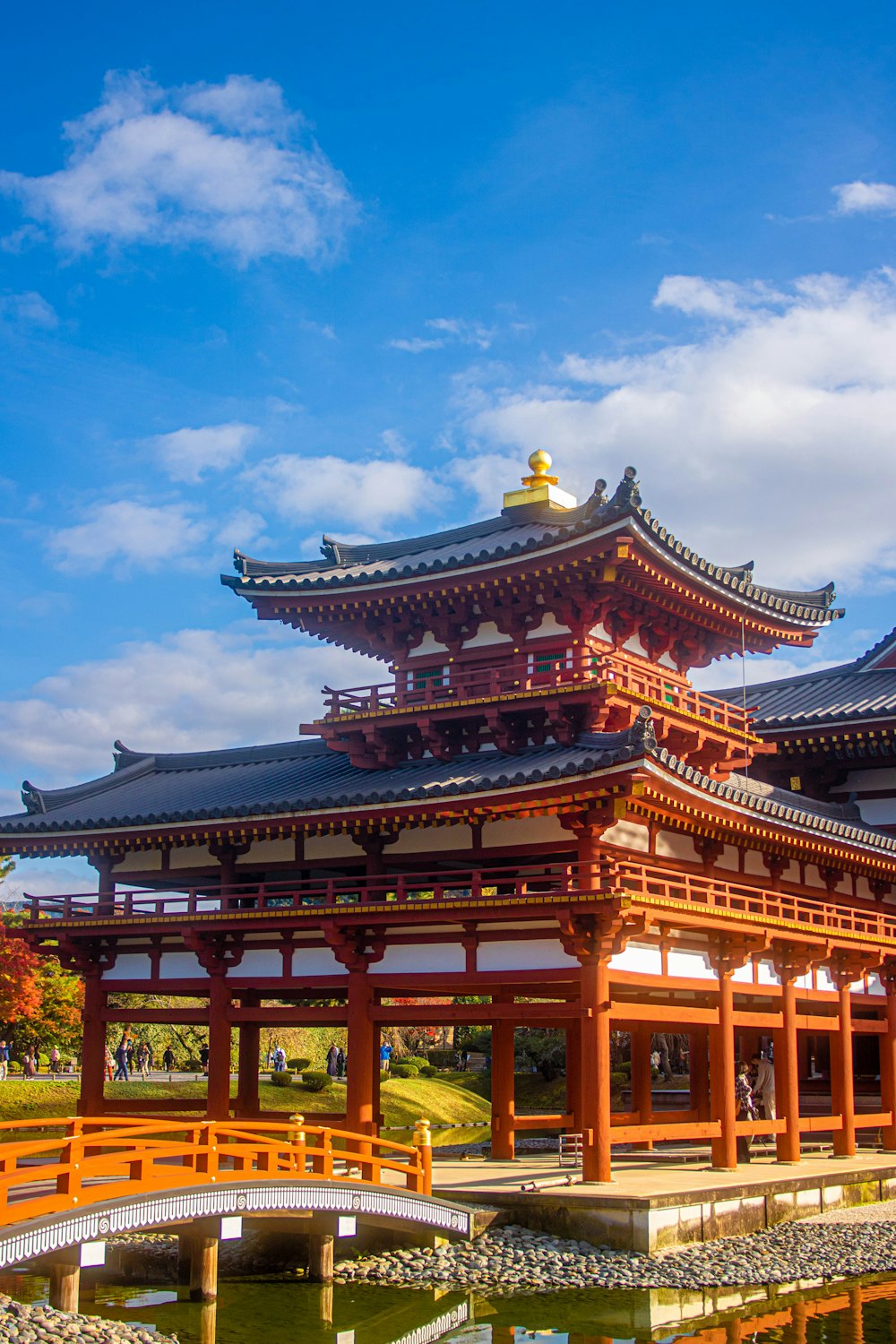 a large building with a bridge in front of it