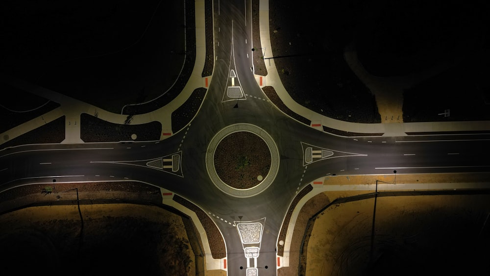 an overhead view of an intersection at night