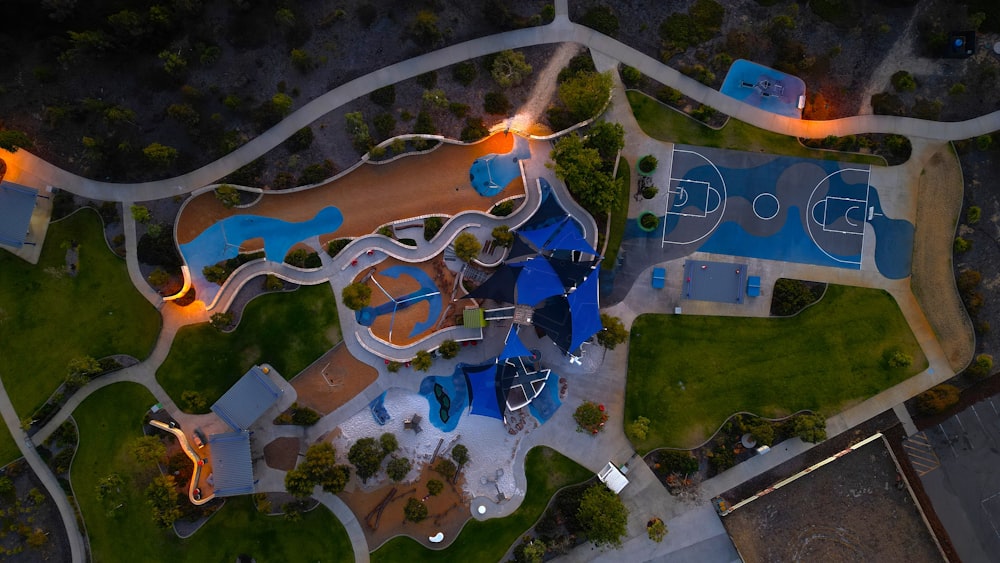 an aerial view of a park with a basketball court