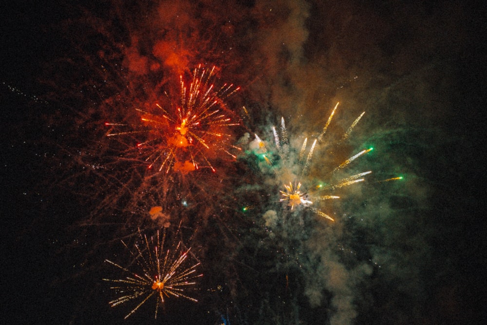 a bunch of fireworks are lit up in the night sky