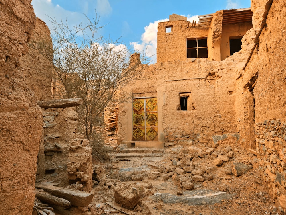 a stone building with a wooden door and window