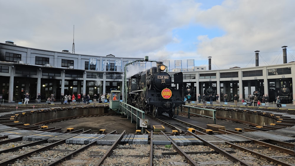 a train on a train track in a train station