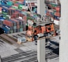 an overhead view of cargo containers and a crane
