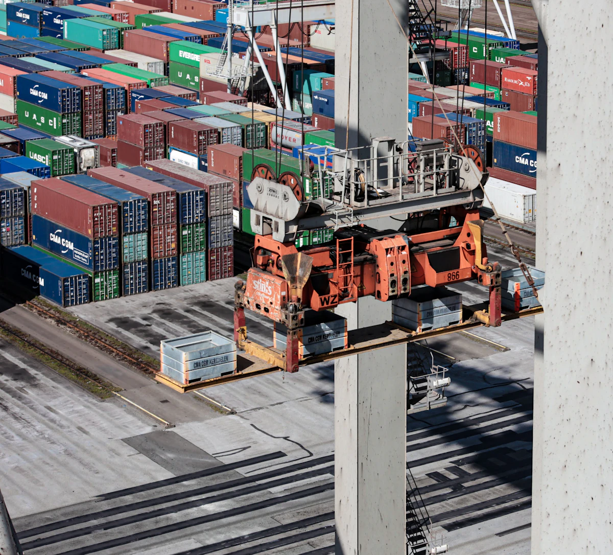 Container terminal crane handling cargo at a port
