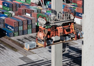 an overhead view of cargo containers and a crane