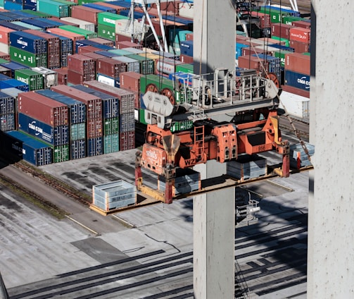 an overhead view of cargo containers and a crane