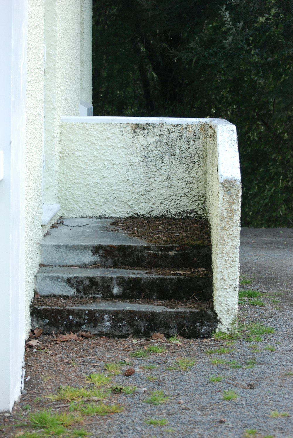 a set of steps leading up to a white building