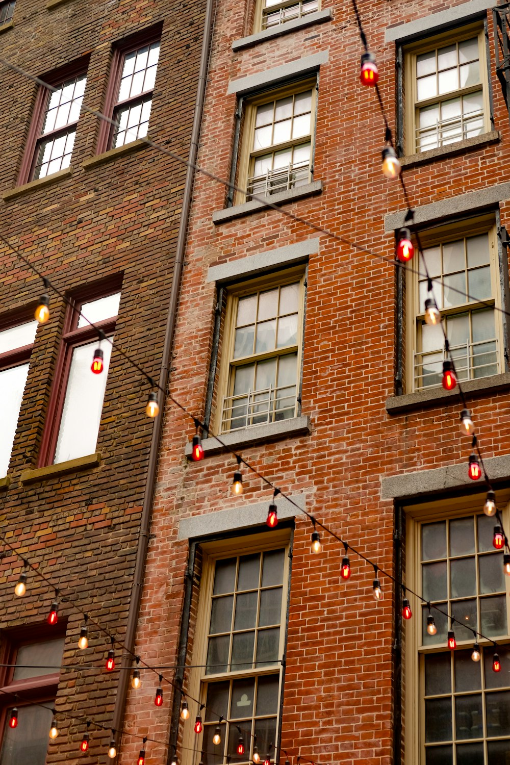 a tall brick building with lots of windows