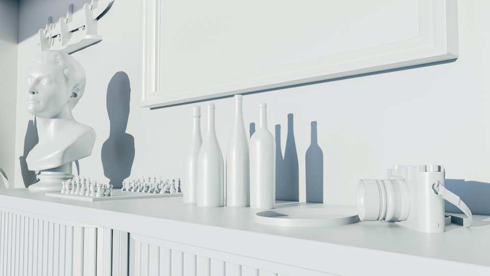 a white shelf with a mirror, toothbrushes, and a sculpture on it