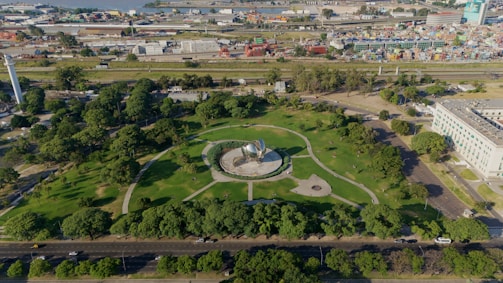 an aerial view of a park and a city
