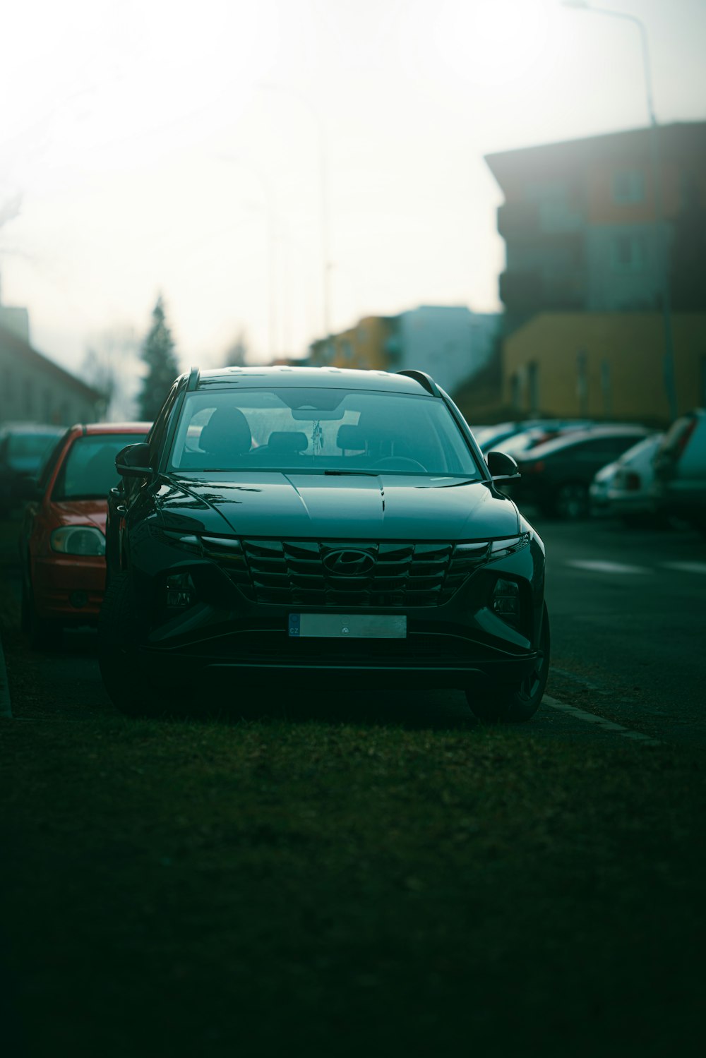 a couple of cars parked in a parking lot