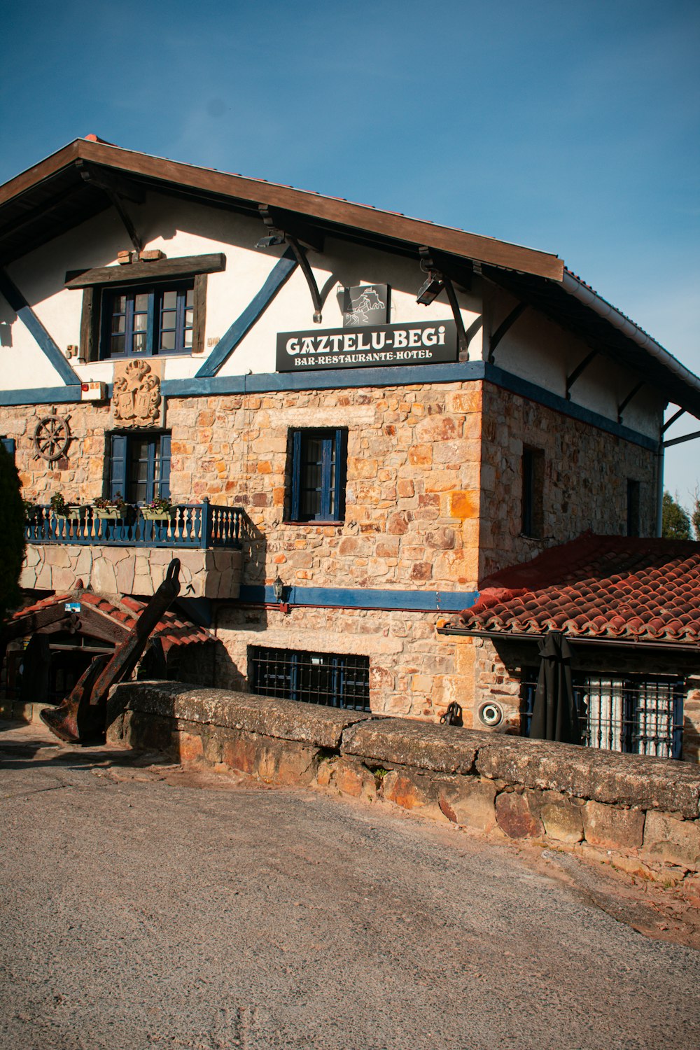 a stone building with a horse drawn carriage in front of it