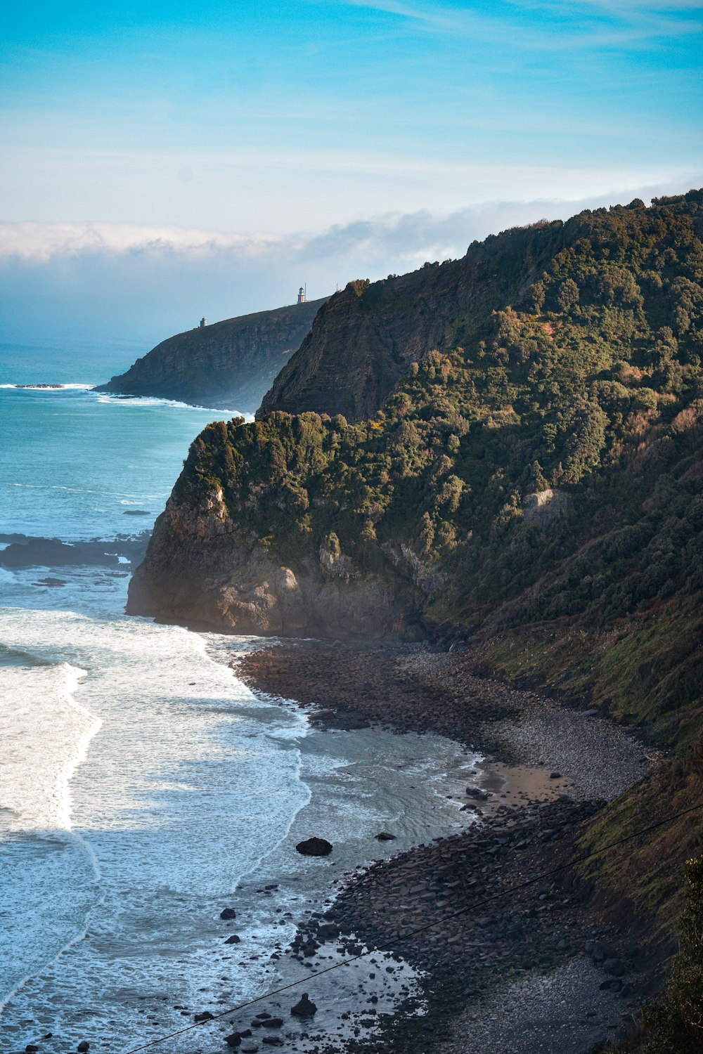 a view of the ocean from a high cliff