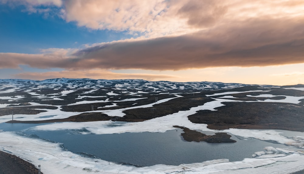 an aerial view of a snow covered landscape