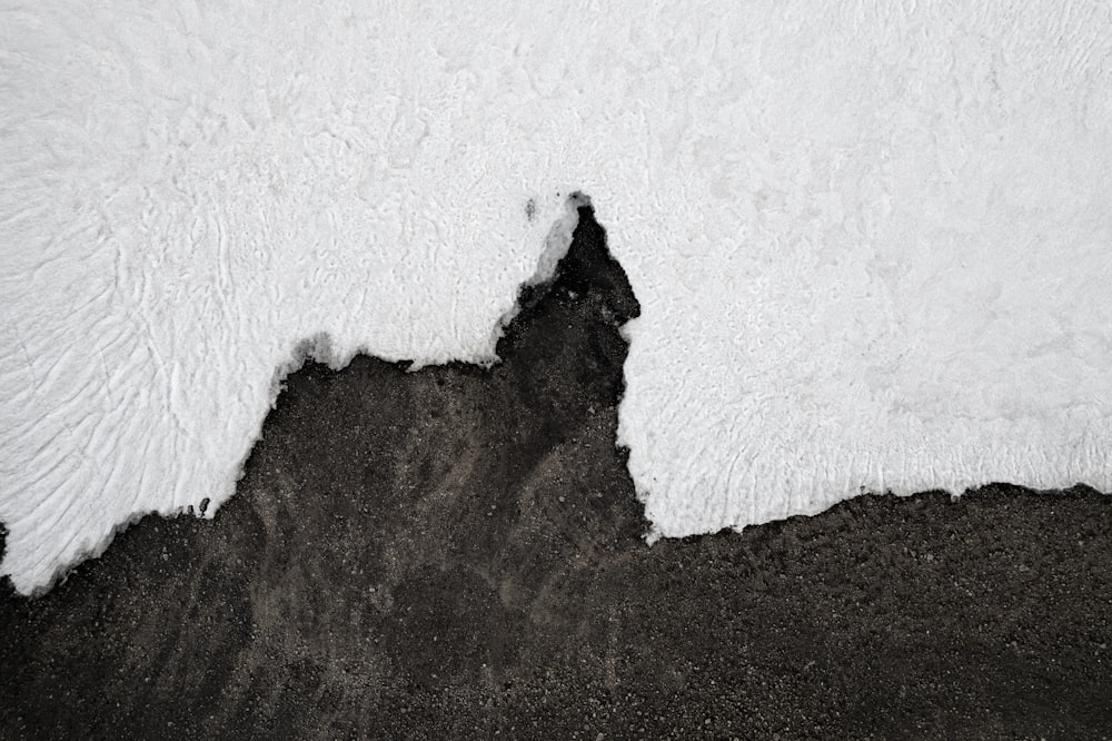 a black and white photo of ice on the ground