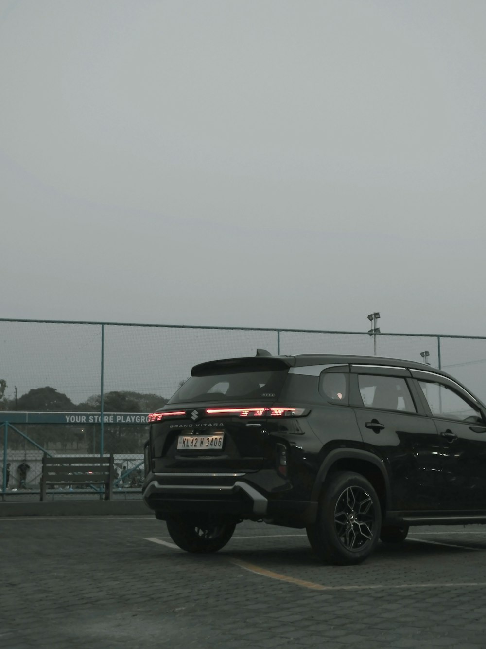 a black suv parked in a parking lot