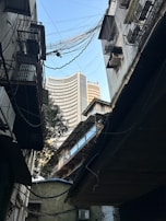 a view of a city from a narrow alleyway
