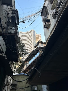 a view of a city from a narrow alleyway
