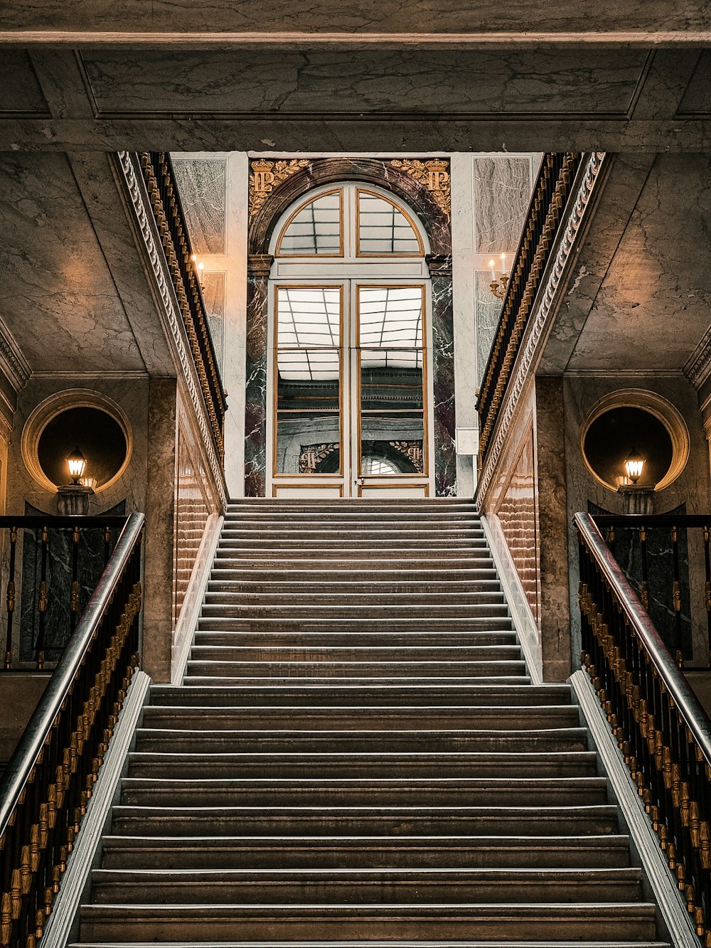 a staircase leading up to a window in a building