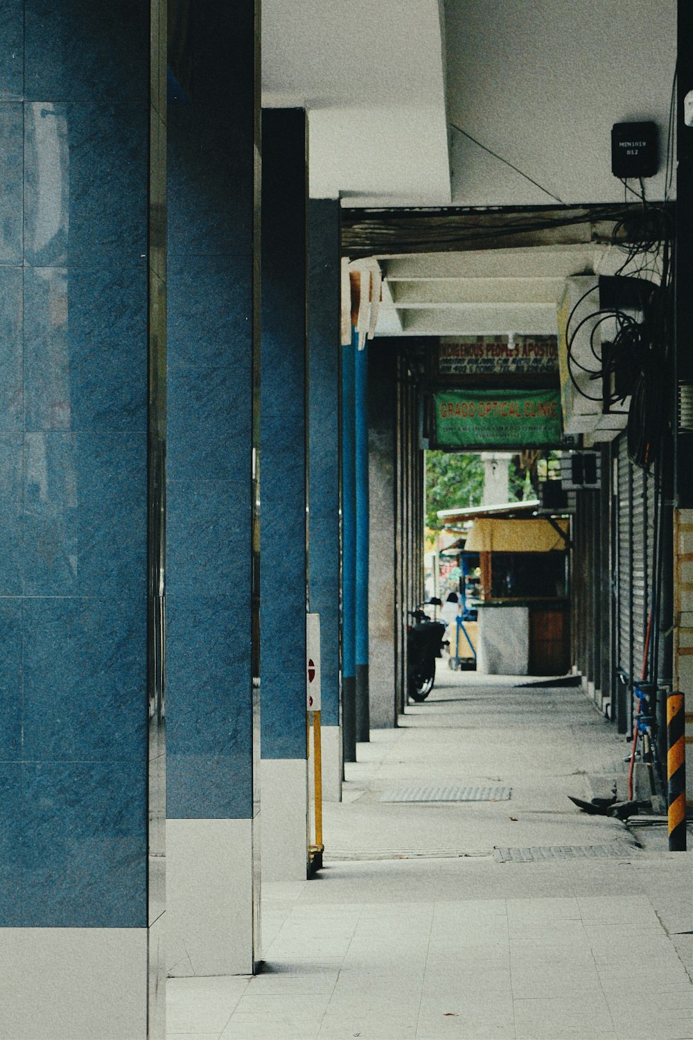 a long hallway with a clock on the side of it