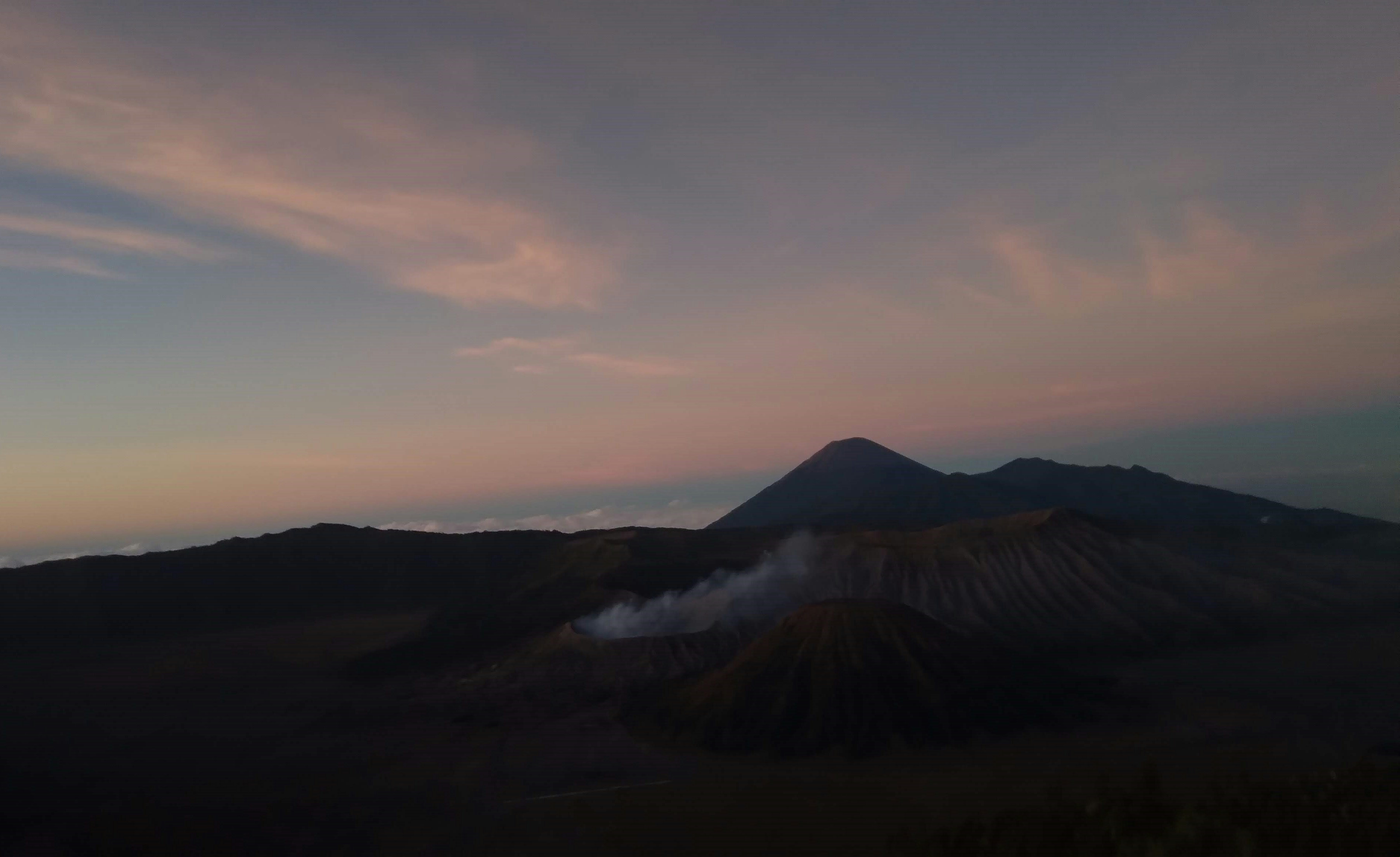 Capturing the mesmerizing sunrise over Mount Bromo on July 15, 2023, this photograph encapsulates nature's breathtaking spectacle, illuminating the serene landscape with warm hues.