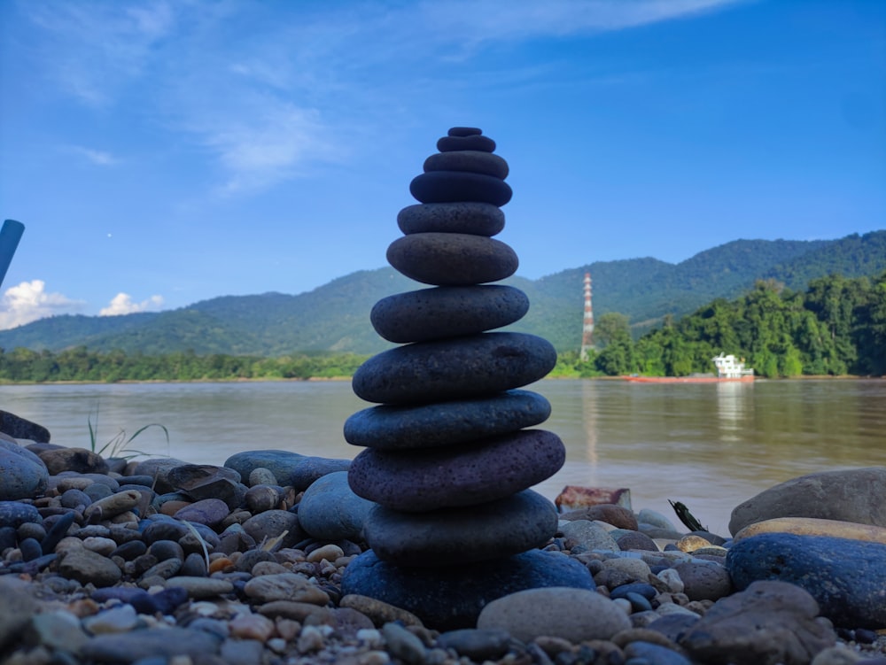 a stack of rocks sitting on top of a rocky beach