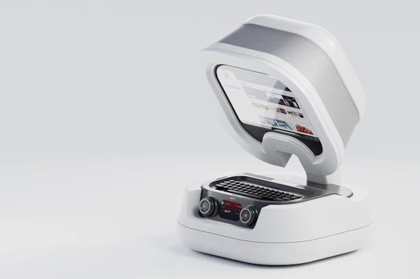 a white machine with a laptop on top of it