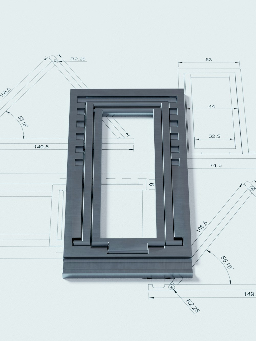 a picture frame sitting on top of a blueprint