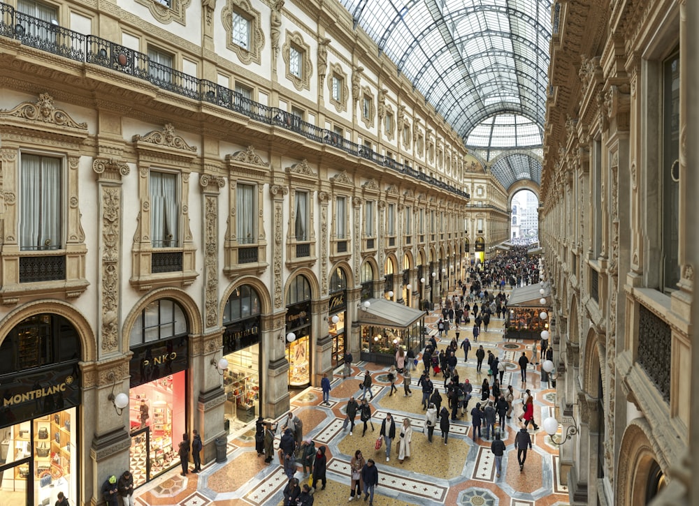 a group of people that are walking around in a building