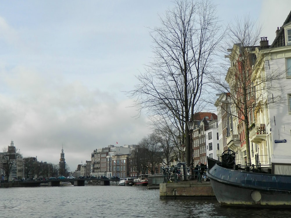 a boat is parked on the side of a river