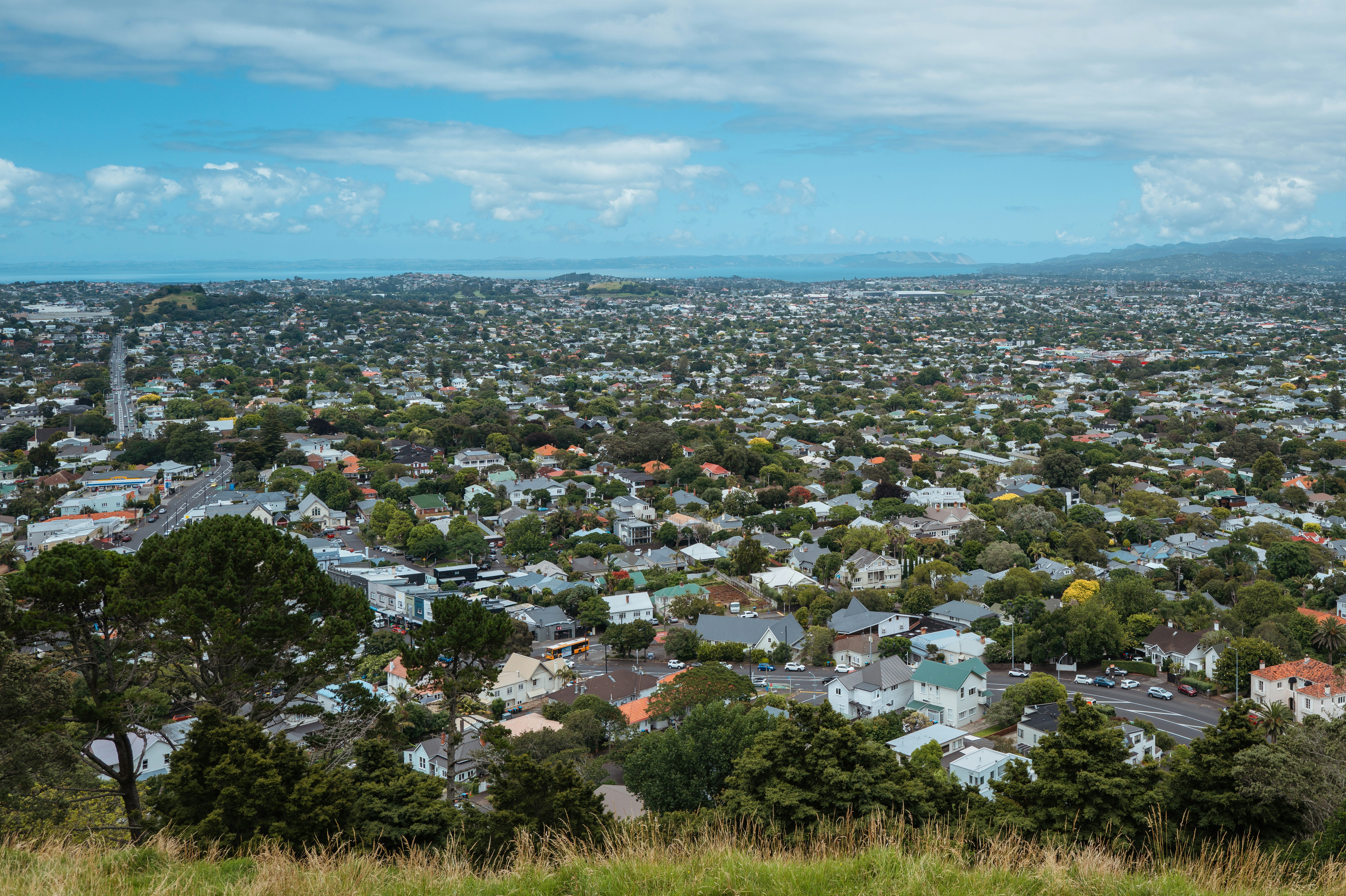 a view of a city from the top of a hill