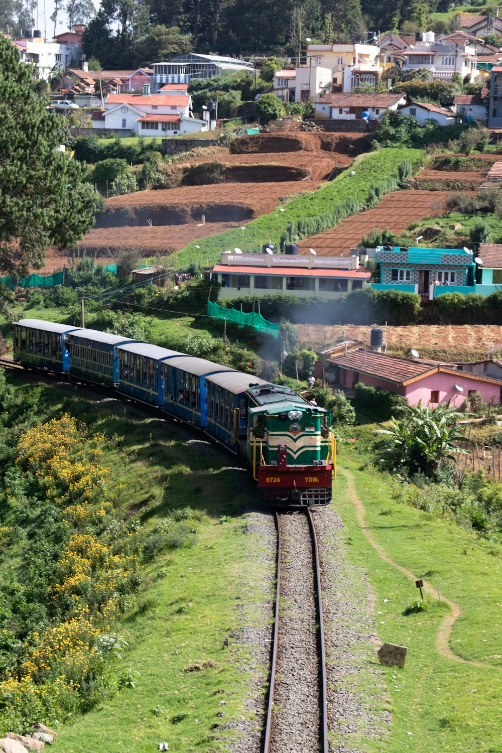 a train traveling through a lush green countryside