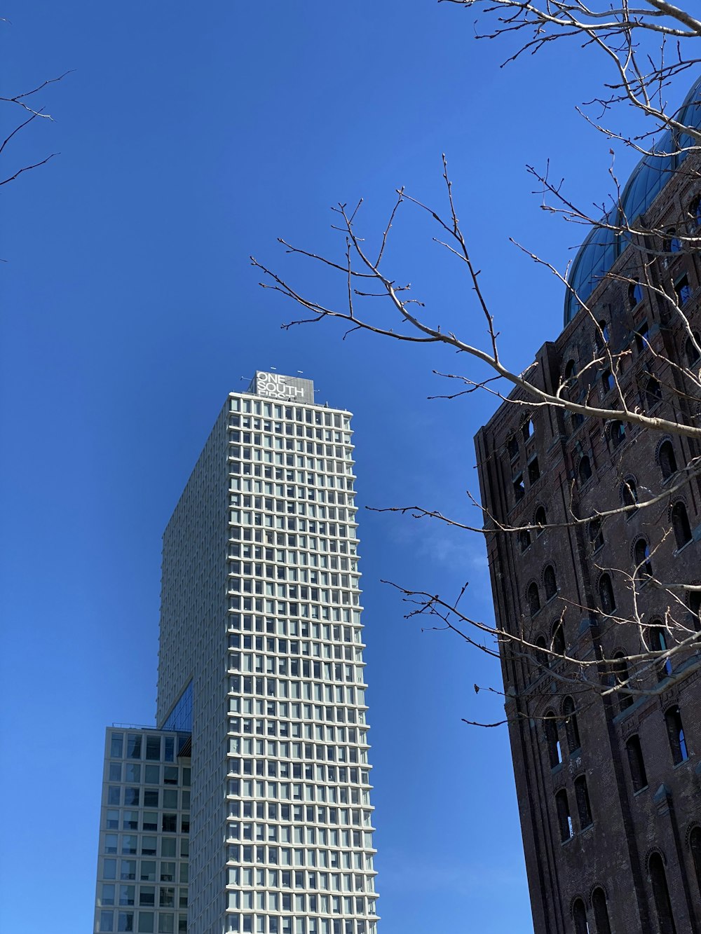 a very tall building next to a very tall building