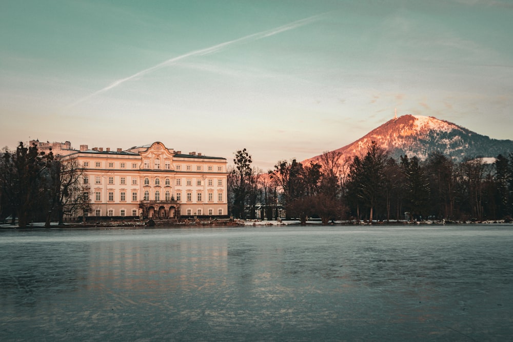 a large building sitting on top of a lake