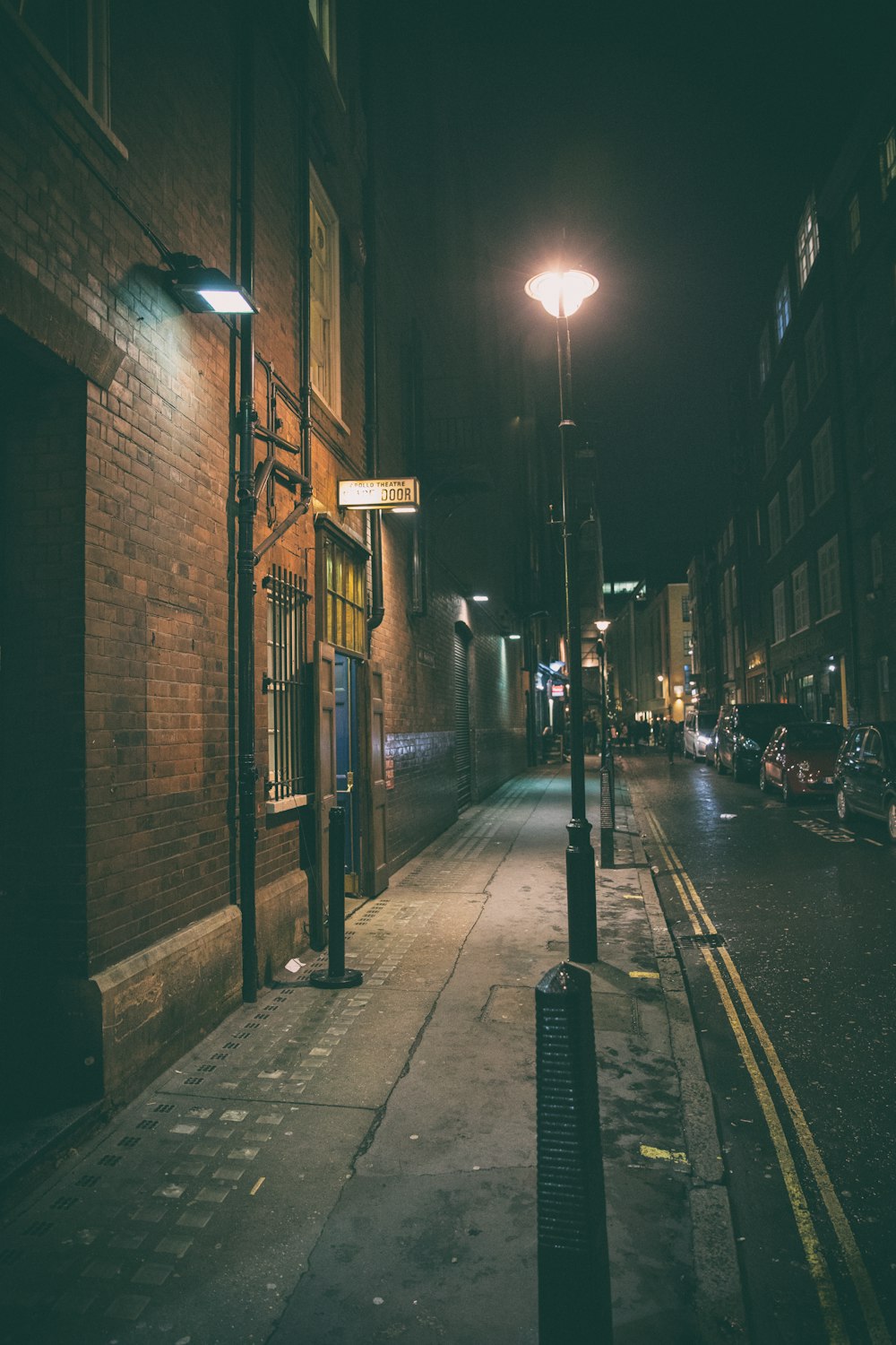 a city street at night with a light on