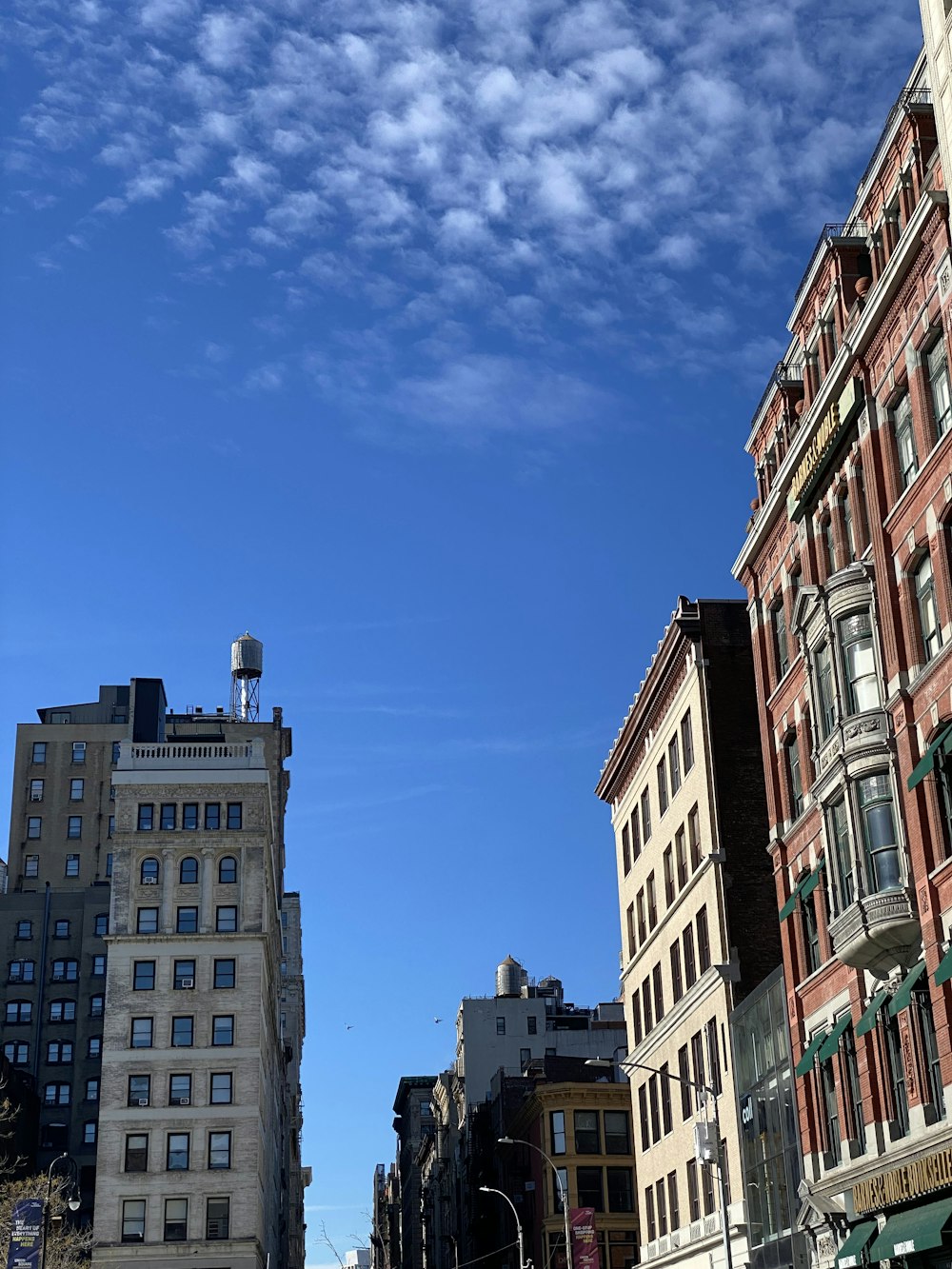 a city street filled with lots of tall buildings