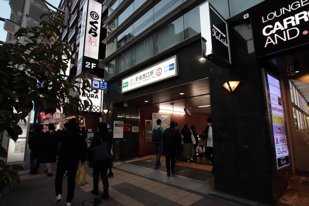 a group of people standing outside of a building