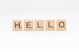 scrabbled wooden blocks spelling the word hello