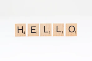 scrabbled wooden blocks spelling the word hello