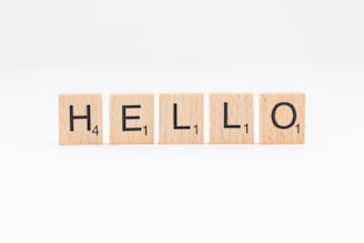 scrabbled wooden blocks spelling the word hello