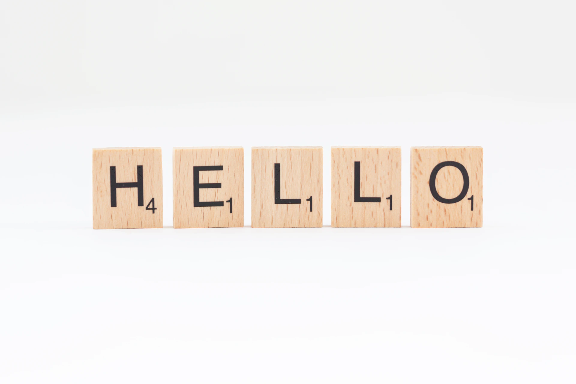 scrabbled wooden blocks spelling the word hello